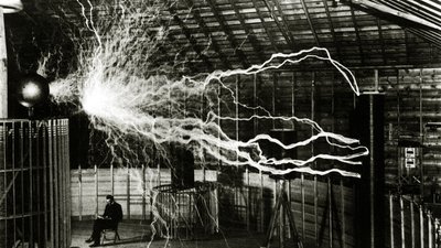 A Multiple Exposure Picture of Tesla with His Magnifying Transmitter by Unknown